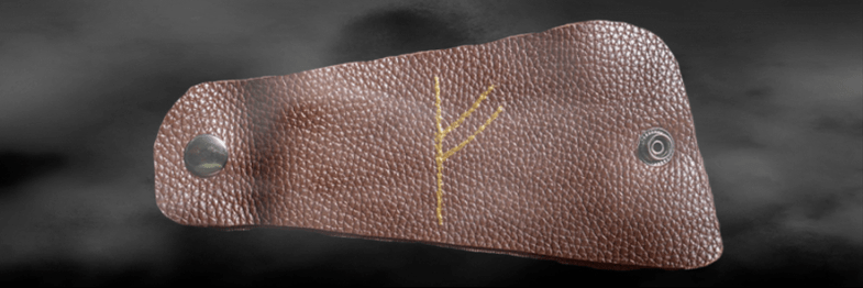 Runa Fehu na pele como amuleto de boa sorte